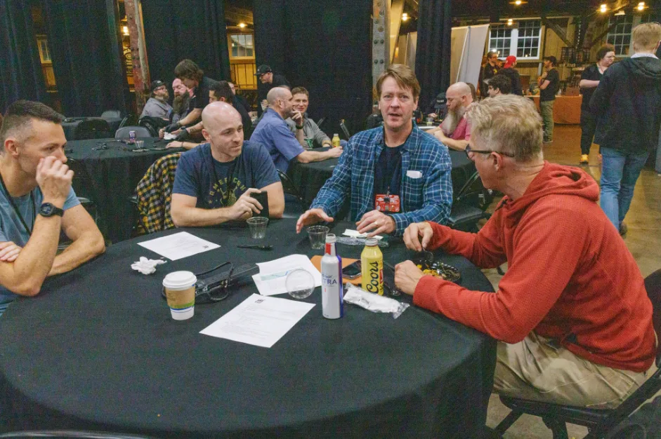 Two security professionals having a discussion at a cybersecurity conference